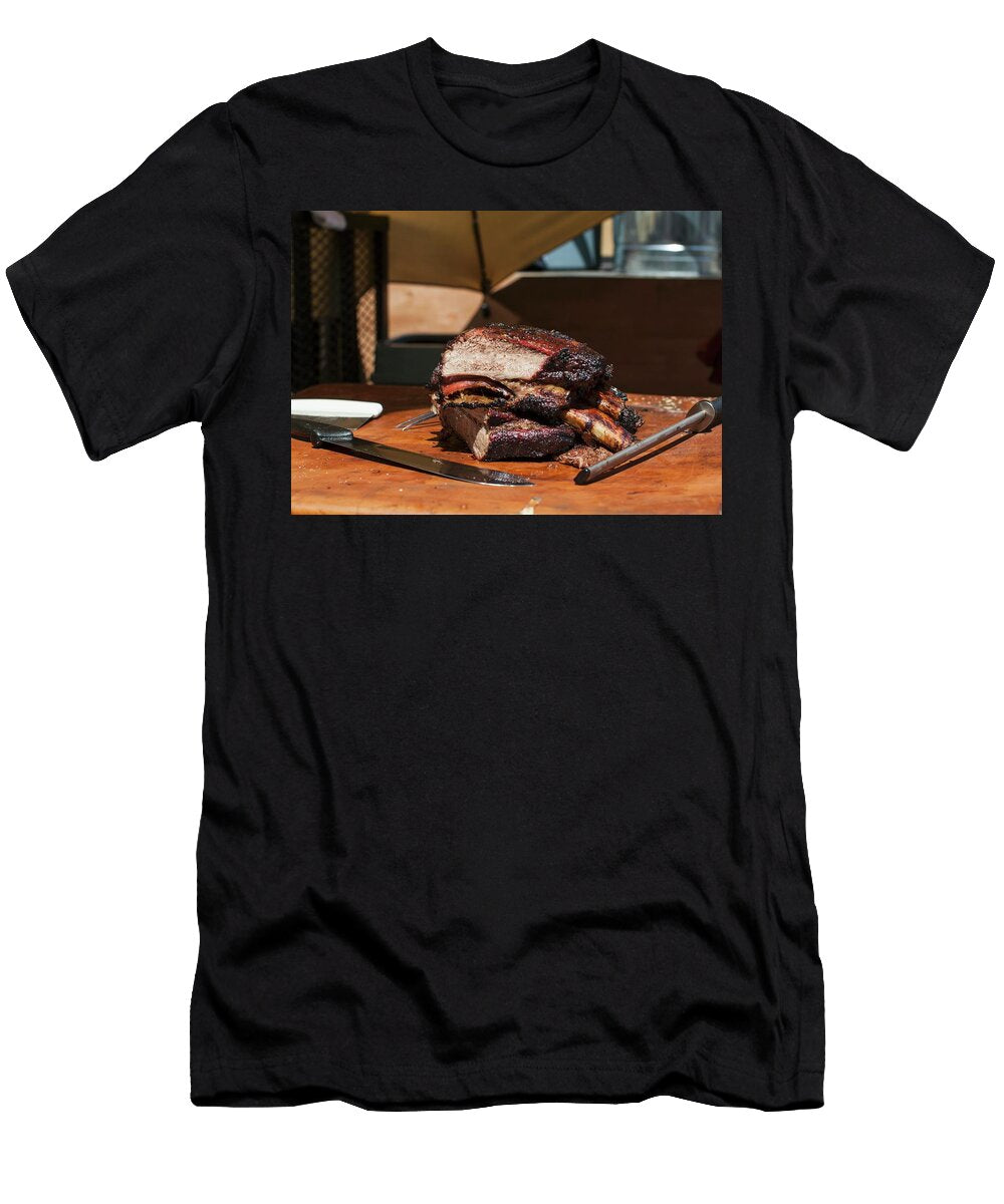 Barbequed Beef Ribs Stacked on a Cutting Block in the Sun with a Carving Knife and Sharpening Tool Don Crossland T-Shirt