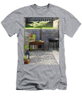 Potted Herbs and Harvested Vegetables on Rusty Metal Side Table Next to Barbecue on Gravel Area in Garden Peter Carlsson T-Shirt